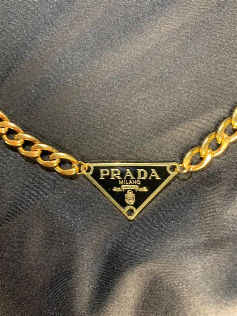 prada chin necklace